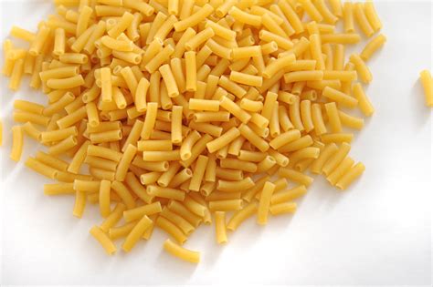 Pile of Dry Uncooked Macaroni on White Background - Free Stock Image