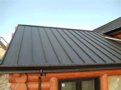 Standing Seam Metal Roof On A Log House Being Built In California