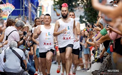 men in heels race in pride month celebration in madrid