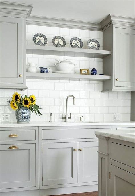 The cabinets are made with a traditional farmhouse structure in mind, but their painted grey cabinets, white stone countertops, and subway tile backsplash keep the look fresh. 94+ Remarkable Farmhouse Gray Kitchen Cabinet Design Ideas ...