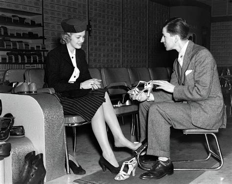 S Shoe Salesman Helping Woman Try Photograph By Vintage Images Pixels