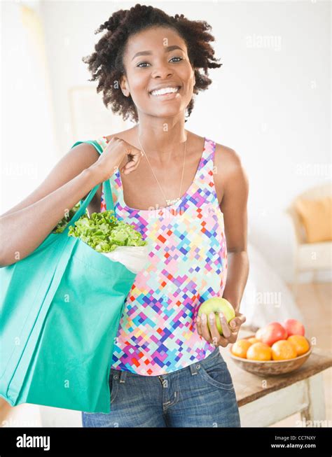 Black Woman Carrying Reusable Grocery Bag Stock Photo Alamy