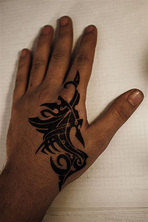 Black Tribal Hand Tattoo Design
