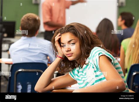 Bored Female Teenage Pupil In Classroom Stock Photo Alamy