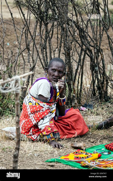 Old Masai Woman Sitting In The Masai Village In Kenya Africa Stock