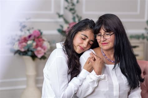 Premium Photo Mexican Mother And Daughter Hugging On Mothers Day