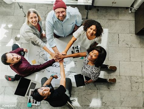 Download Premium Image Of Happy Team Stacking Hands On A Creative Ideas