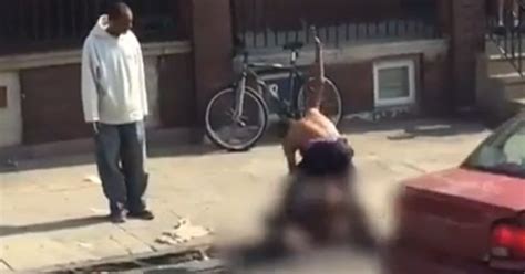 Horrifying Footage Shows Shirtless Man Viciously Beating Woman In Street As Onlookers Laugh