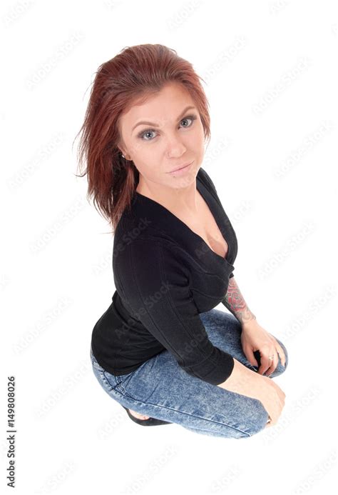 Surprised Young Woman Crouching On Floor Stock 写真 Adobe Stock