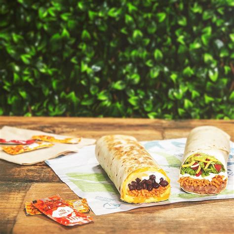 A flour tortilla layered with your choice of protein, warm nacho cheese sauce, a crunchy flat taco shell, sour cream. Taco Bell Just Launched A Vegetarian Crunchwrap Supreme ...