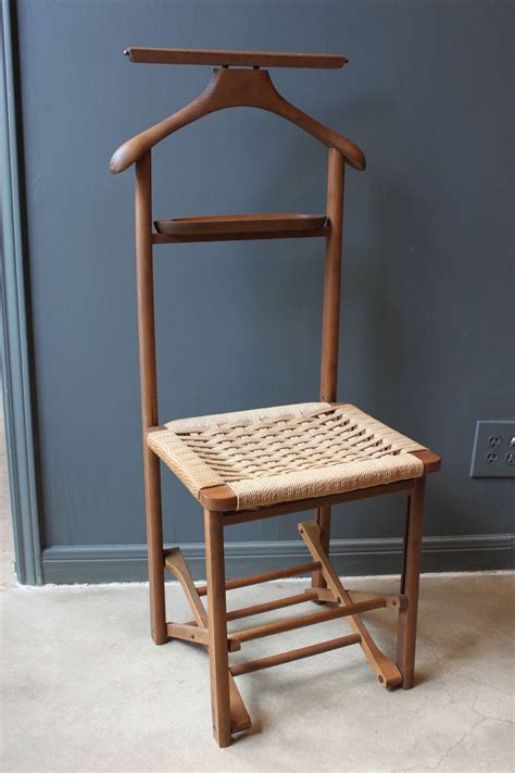 An old ageing ornate wooden chair. Vintage Wood Valet Folding Chair with Woven Caned Seat ...