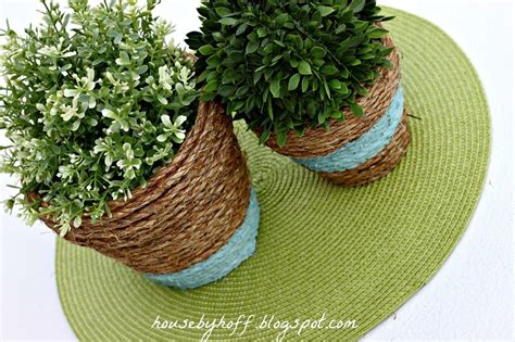 The ropes are wrapped around the log, giving the light fixture an interesting texture. Simple DIY Ways To Customize Terracotta Pots