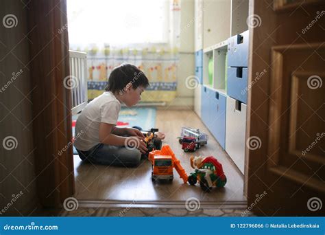 Boy Playing Alone In The Room Loneliness Stock Photo Image Of Door