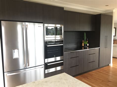 Contemporary melamine kitchen cabinets in pier finish. Woodgrain melamine with stainless benchtop | Kitchen renovation, Interior, Home decor