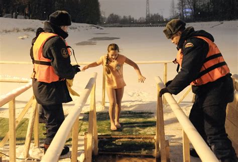 Russians Plunge Into Icy Water To Mark Epiphany