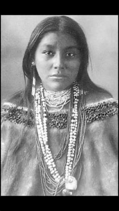 An Old Photo Of A Native American Woman With Beads And Necklaces On Her Neck