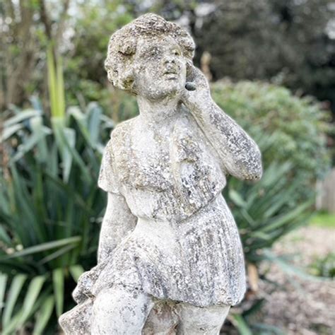 An English Composition Stone Figural Garden Statue Of A Girl Lassco