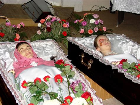 Preparing a dead body in the casket. Women in casket - Section 33