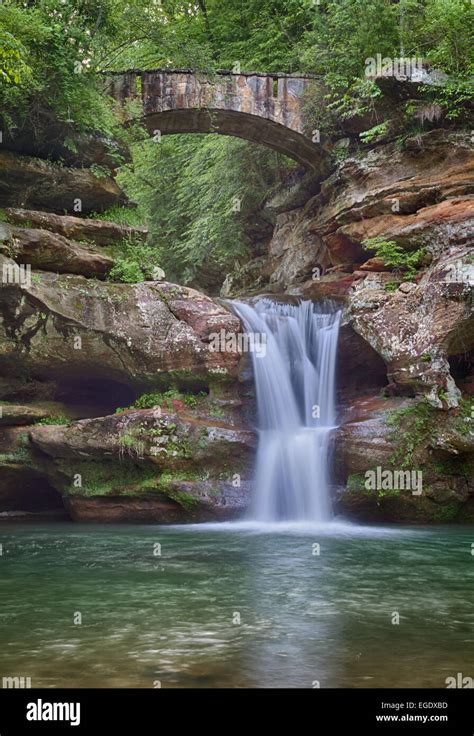 Waterfall Under An Arch Stock Photo Alamy