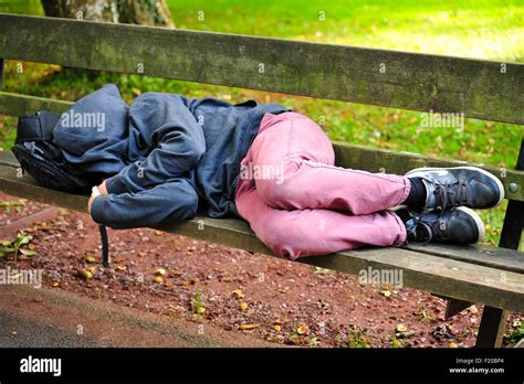Sleeping Boy On Park Bench Stock Photo Alamy
