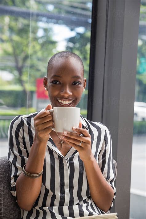Portrait Of Beautiful Young African American Woman Drinking Coffee By