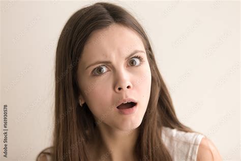 Headshot Portrait Of Confused Young Woman Beautiful Teen Girl With Shocked Facial Expression