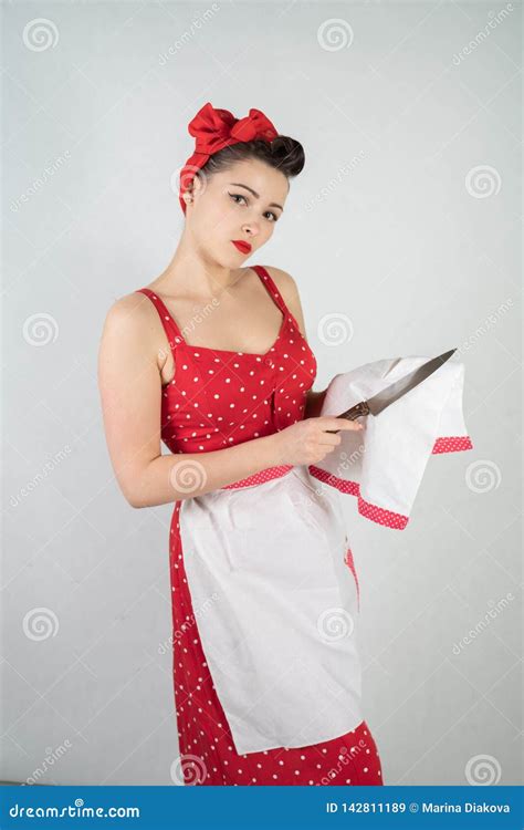 Dangerous Pin Up Girl Housewife In Red Vintage Polka Dot Dress Stands