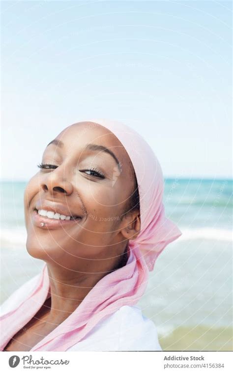 Confident Black Woman On Seashore A Royalty Free Stock Photo From