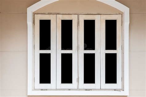 White Painted Wooden Window Frame And White Cement Wall Stock Photo