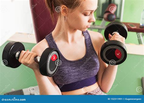 girl does exercise with dumbbells stock image image of fitness beauty 152311991