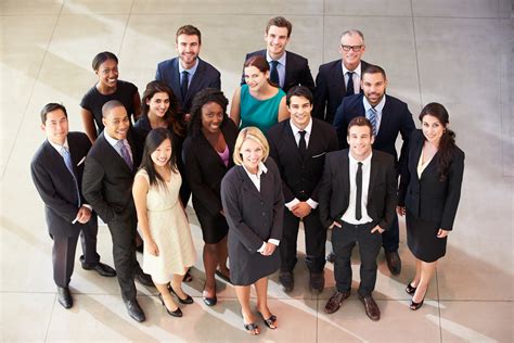 Portrait Of Multi Cultural Office Staff Standing In Lobby The Finch Group