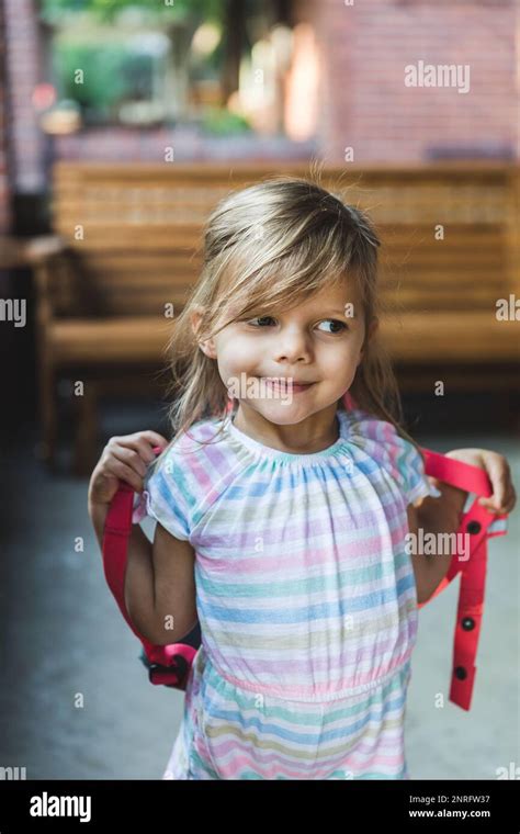 Preschool Aged Girl Wearing Backpack Outside Stock Photo Alamy