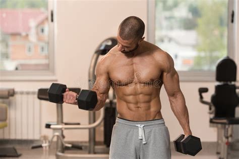 Bodybuilder Exercising Biceps With Dumbbells Stock Photo Image Of