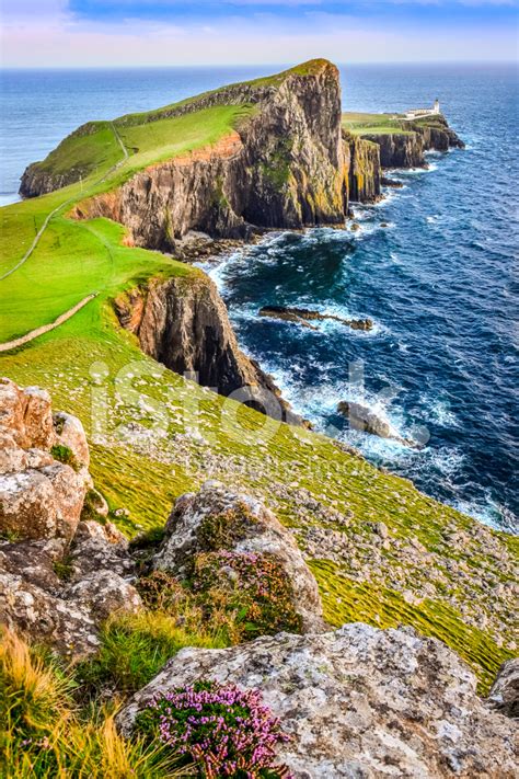 Neist point lighthouse on the isle of skye, including a clip of its original optical aparatus in the museum of scottish lighthouses. Vertical View of Neist Point Lighthouse and Rocky Ocean Coastlin Stock Photos - FreeImages.com
