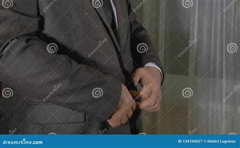 Status Caucasian Man Businessman Wears A Suit Jacket And Straightens