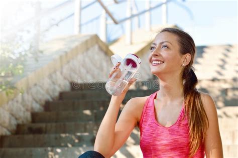 Sporty Woman Drinking Water After Jogging Stock Photo Image Of