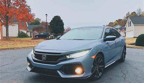 Joining the Honda family in a brand new 2018 Civic Hatchback Sport Touring in Sonic Gray Pearl