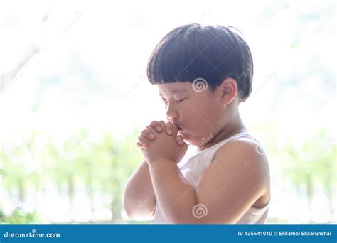 A Little Prayer A Boy Is Praying Seriously And Hopefully To Jesus