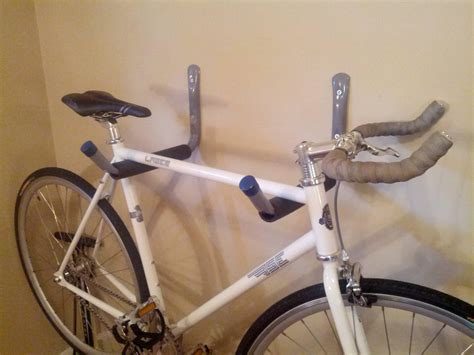 It's a decorative shelf and a rack in one. Cheap and simple DIY bike rack. All you need is two wall ...