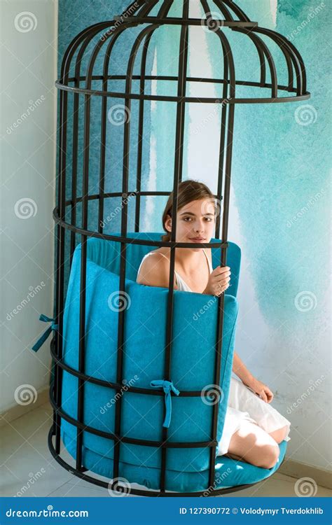 Mental Mind Prisoner Woman In Cage Home Confinement Freedom Of Cute Girl In Cage Chair Stock