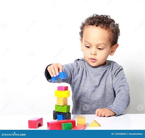 Little Boy Testing His Creativity By Building Towers With Toy Building