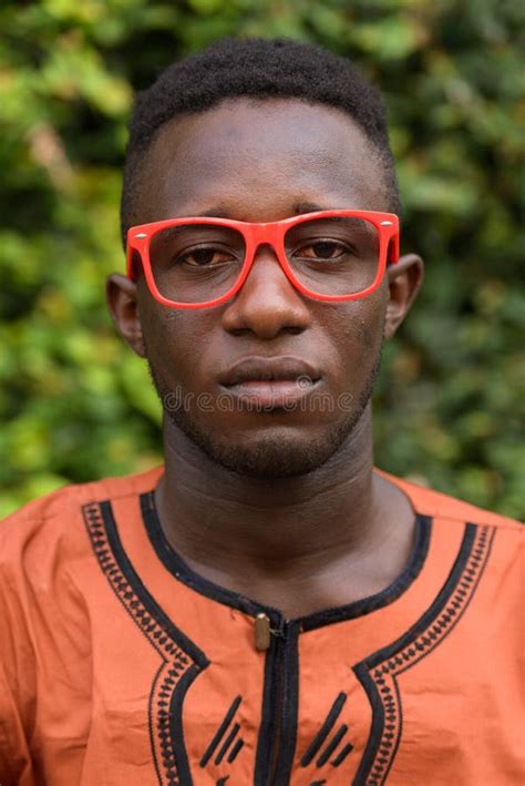 Face Of Young African Man Wearing Traditional Clothing And Eyeglasses