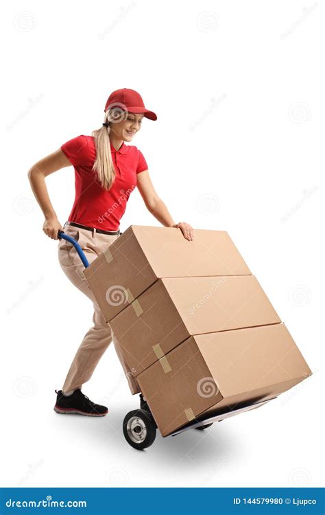 Female Worker Pushing A Hand Truck Loaded With Boxes Stock Photo