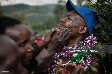 A Circumcised Maasai Young Man Reacts As Her Mother Puts Milk Butter
