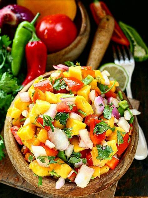 This is a spicy, tangy and sweet mango salsa made with ripe mangoes, red bell pepper, onions and spices. Fresh and Healthy Mango Salsa | Mango salsa recipes, Mango salsa, Fun easy recipes