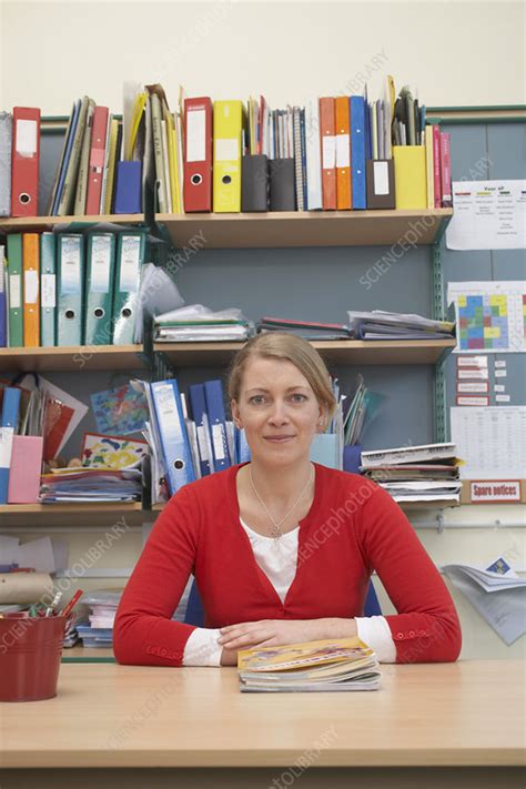 Teacher Sitting At Her Desk Stock Image F003 3317 Science Photo Library