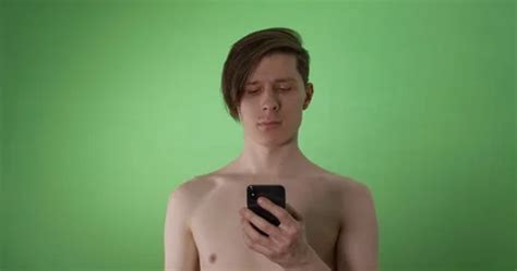A Naked Man Talking On The Phone On Gree Stock Video Pond