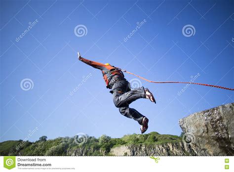 Jump Off A Cliff With A Rope Stock Photo Image Of Male Mountain