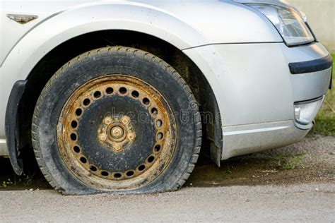 Car With Flat Tire On Old Rusty Rim Stock Image Image Of Tire Silver