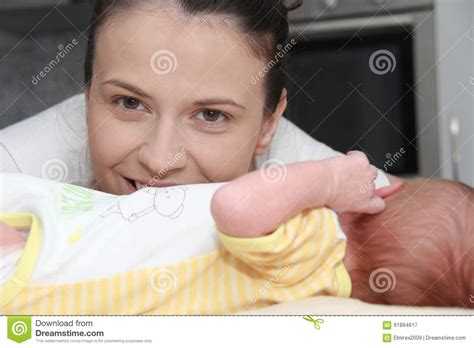 Mother And Her Newborn Baby Parent Holding Newborns Hands Stock Image